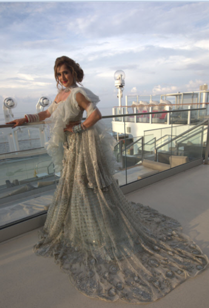 Reception outfit, ice blue shade with a long train and ruffled drape